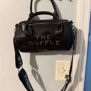 The Duffle Black small bag.